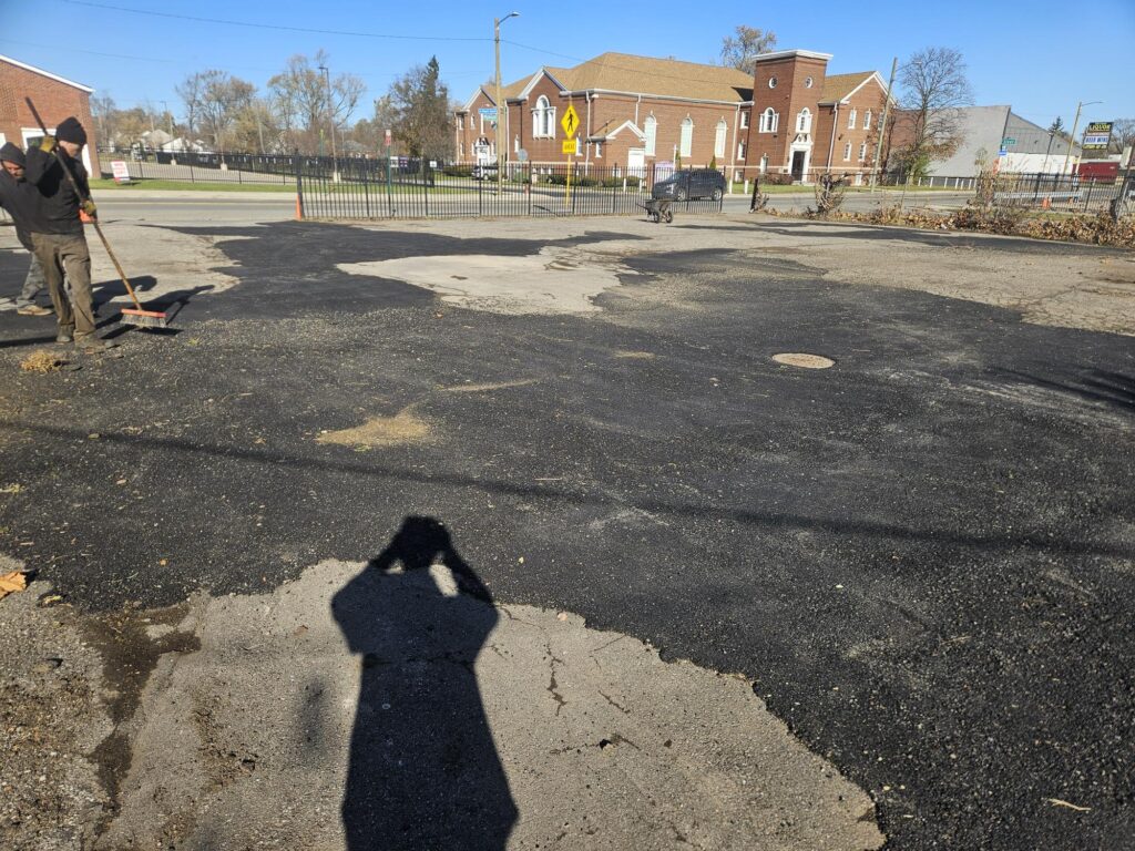 Commercial asphalt pothole patching and parking lot repair.