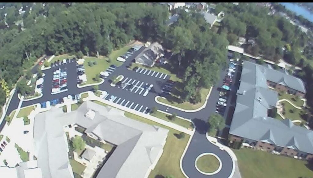 Commercial asphalt paving project at apartment complex parking lot.