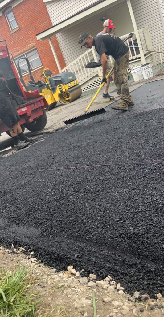 asphalt paving crew installing driveway Michigan