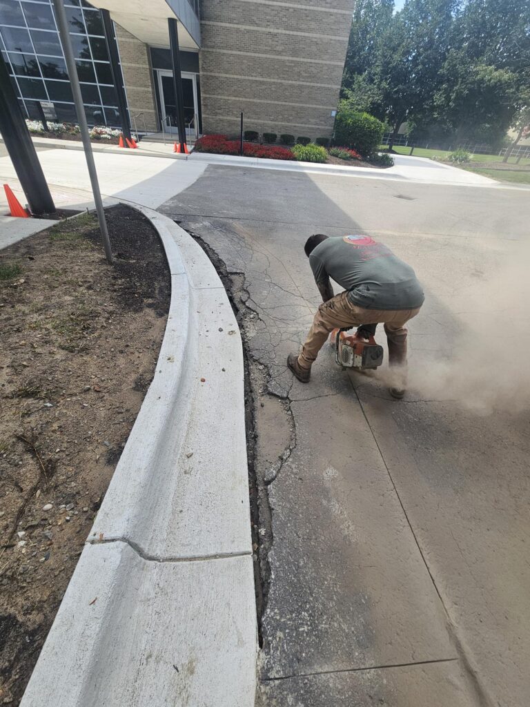 Saw cutting asphalt for crack repair and patch preparation.