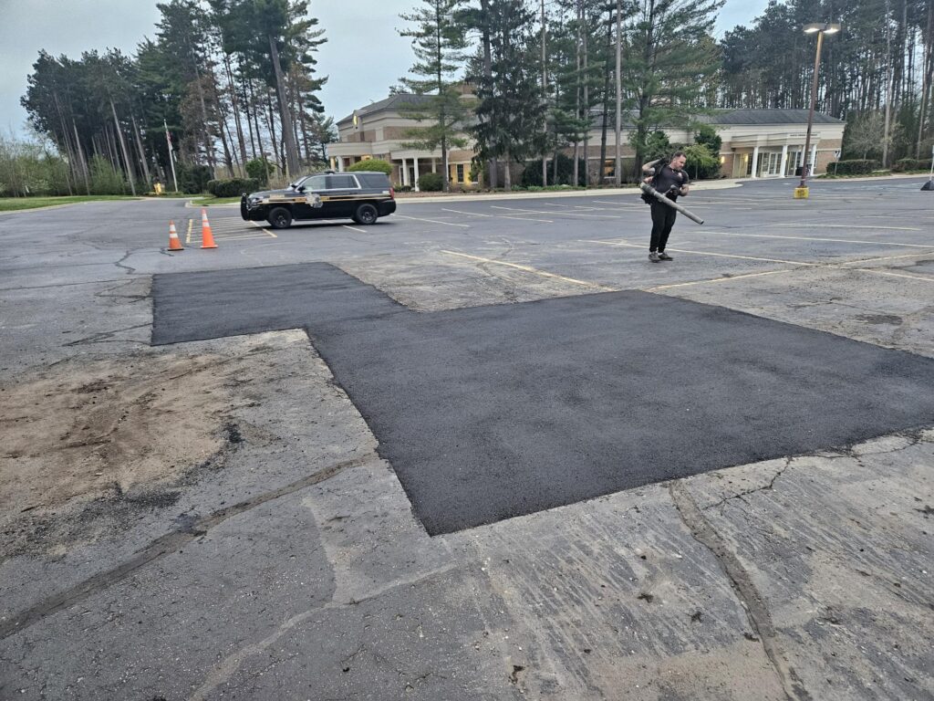 Commercial parking lot asphalt patch repair and resurfacing.